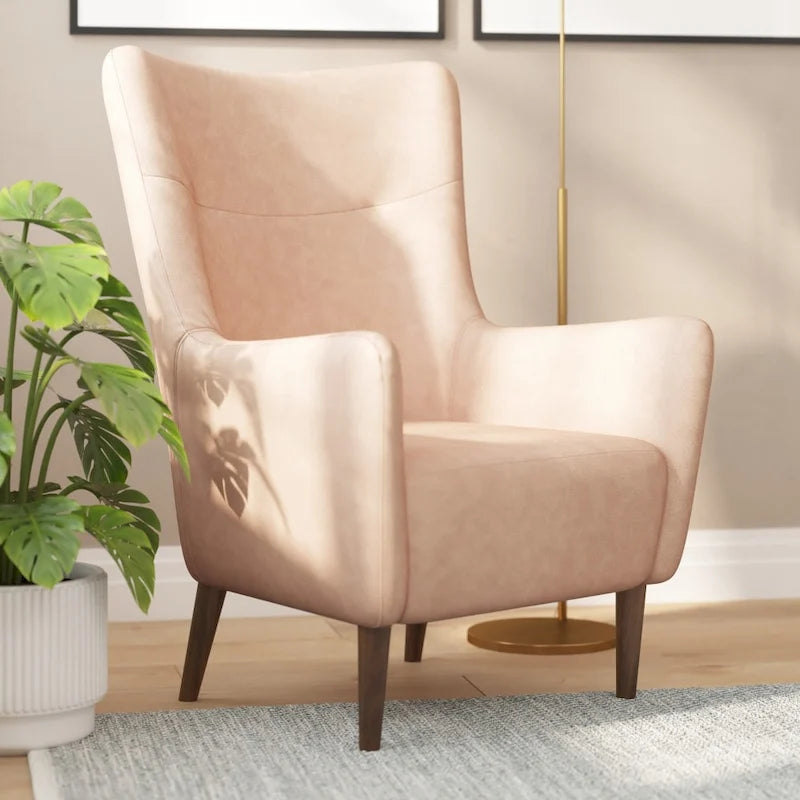 Sillón tapizado de respaldo alto con estructura de madera