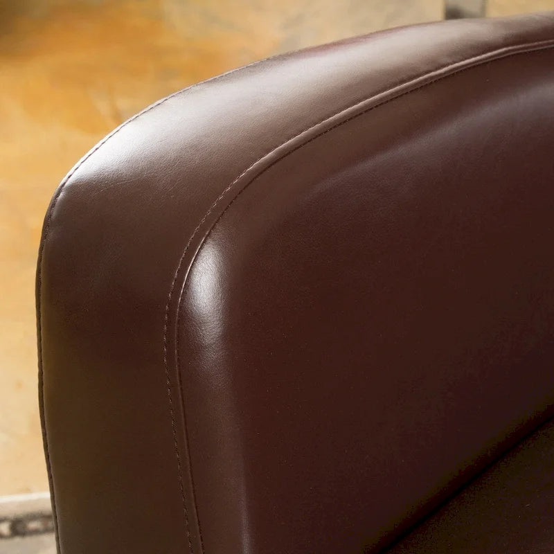 Sillón giratorio estilo club con respaldo alado de cuero regenerado